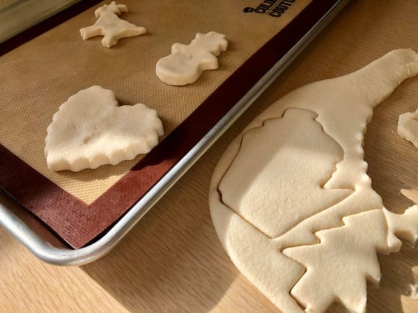 Christmas cookie cutters. State of Wisconsin cookie cutter. Snowman cookie cutter. Goat cookie cutter. Christmas tree cookie cutter. Heart cookie cutter. Bell cookie cutter. Salt Dough Ornament rolled out with rolling pin for Salt Dough Ornament DIY.