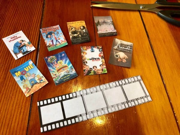 Printed out movie covers for Movie Night idea. Date night idea. Trash to treasure repurposing empty frosting containers to make a movie night DIY. How to reuse empty containers. Frosting Containers. Frosting Container DIY. Goodwill Hunting. Billy Madison. Cloudy With a Chance of Meatballs. The Grand Budapest Hotel. The Simpsons Movie. Spongebob Square Pants the Movie. The Muppets Most Wanted. Marcel the Shell With Shoes On. Film strips. Movie crafts. Movie lovers.