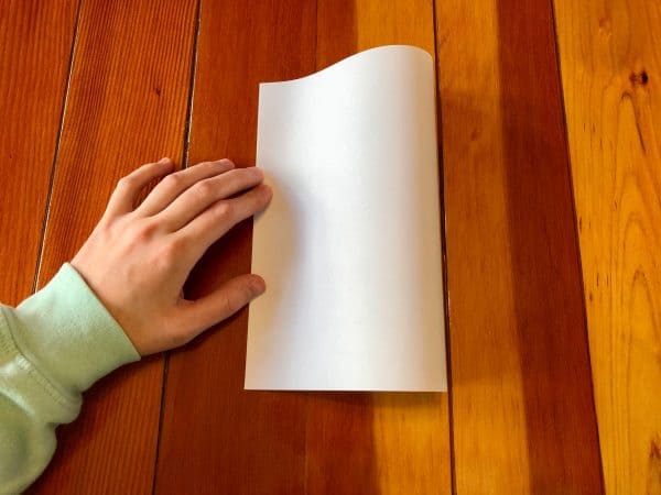 Step one of How to make a zine DIY. How to make a zine tutorial. Zine DIY. Zine ideas. Make your own zine. No staples zine. One piece of paper crafts. One piece of paper zine.