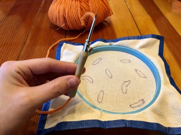 How to make a candle mat DIY. Monks cloth. Embroidery hoop. Painter's tape. Punch Needle project for beginners. Punch Needle ideas. Acrylic Yarn. Punch Needle.