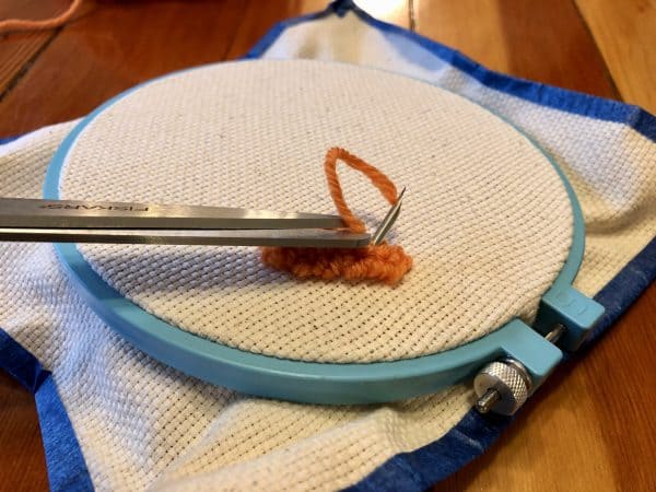 How to make a candle mat DIY. Monks cloth. Embroidery hoop. Painter's tape. Punch Needle project for beginners. Punch Needle ideas. Acrylic Yarn. Punch Needle.