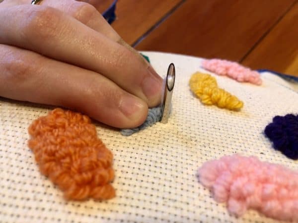 How to make a candle mat DIY. Monks cloth. Embroidery hoop. Painter's tape. Punch Needle project for beginners. Punch Needle ideas. Acrylic Yarn. Punch Needle.
