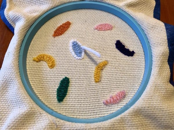 How to make a candle mat DIY. Monks cloth. Embroidery hoop. Painter's tape. Punch Needle project for beginners. Punch Needle ideas. Acrylic Yarn. Punch Needle.