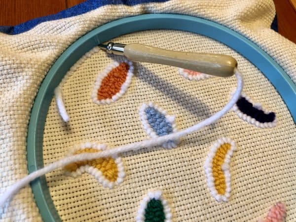 How to make a candle mat DIY. Monks cloth. Embroidery hoop. Painter's tape. Punch Needle project for beginners. Punch Needle ideas. Acrylic Yarn. Punch Needle.