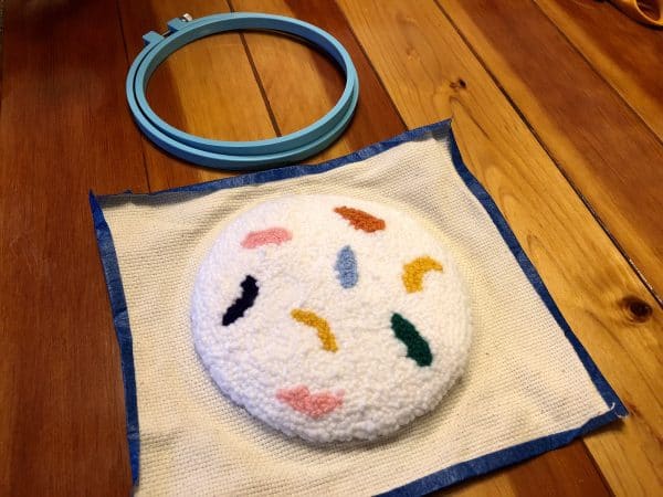 How to make a candle mat DIY. Monks cloth. Embroidery hoop. Painter's tape. Punch Needle project for beginners. Punch Needle ideas. Acrylic Yarn. Punch Needle.