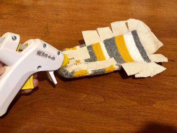 Steps for adorable DIY phone pad made by a punch needle with acrylic yarn.  Punch needle. Punch needle kit. Embroidery Hoop. Monks cloth. Fabric Scissors. Grey, Yellow, and White color scheme. Yarn crafts. Punch needle projects. Phone holder on desk. DIY phone holder.