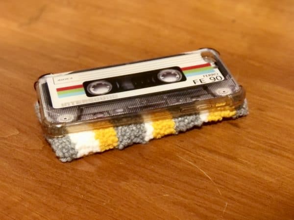 Adorable DIY phone pad made by a punch needle with acrylic yarn. Grey, Yellow, and White color scheme. Yarn crafts. Punch needle projects. Phone holder on desk. DIY phone holder.
