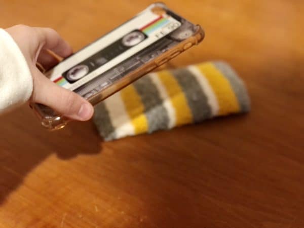Adorable DIY phone pad made by a punch needle with acrylic yarn. Grey, Yellow, and White color scheme. Yarn crafts. Punch needle projects. Phone holder on desk. DIY phone holder.